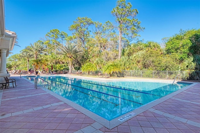 view of swimming pool with a patio