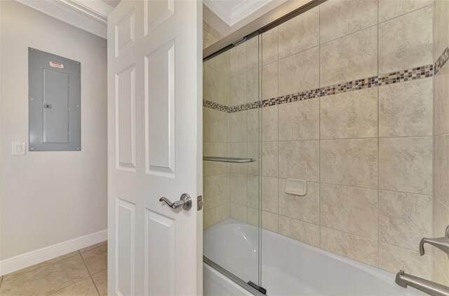 bathroom with shower / bath combination with glass door, tile patterned flooring, electric panel, and ornamental molding