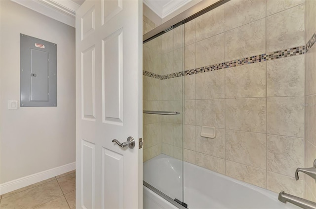 bathroom featuring tile patterned flooring, ornamental molding, combined bath / shower with glass door, and electric panel