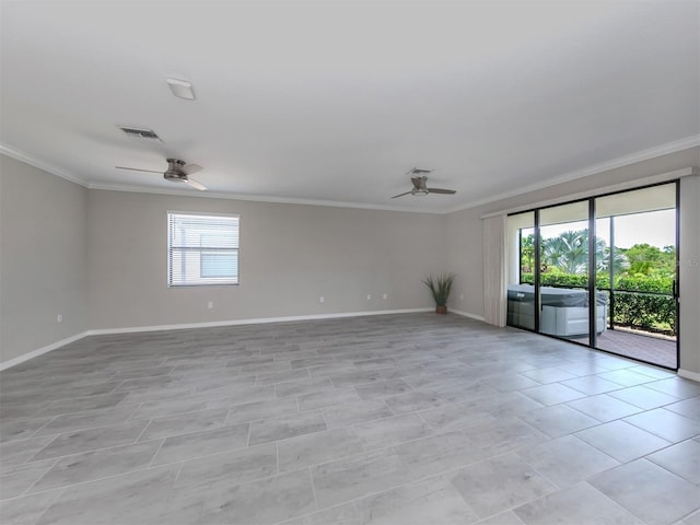 tiled spare room featuring ceiling fan and ornamental molding