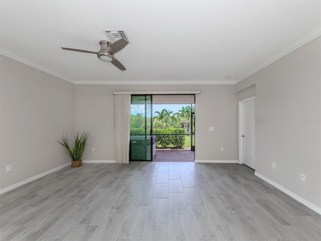 spare room with ceiling fan, ornamental molding, and light wood-type flooring