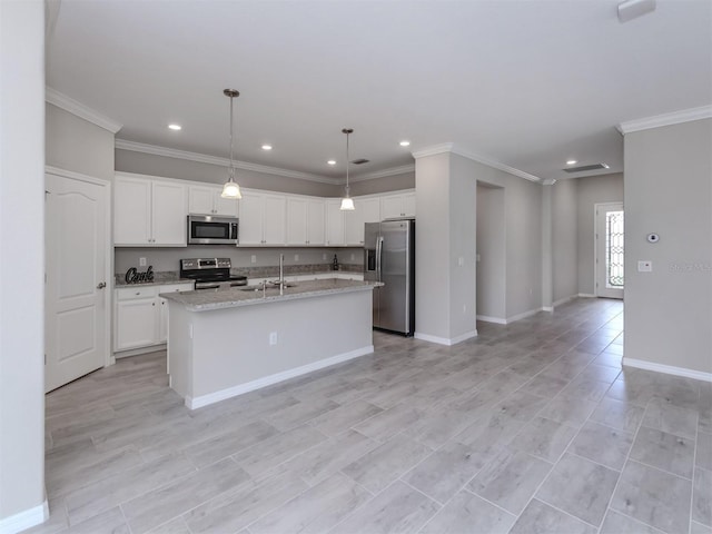 kitchen featuring white cabinetry, sink, hanging light fixtures, a kitchen island with sink, and stainless steel appliances