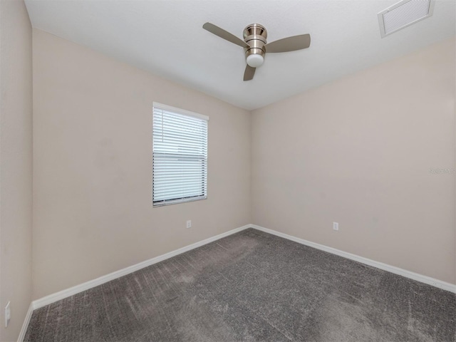 carpeted empty room featuring ceiling fan