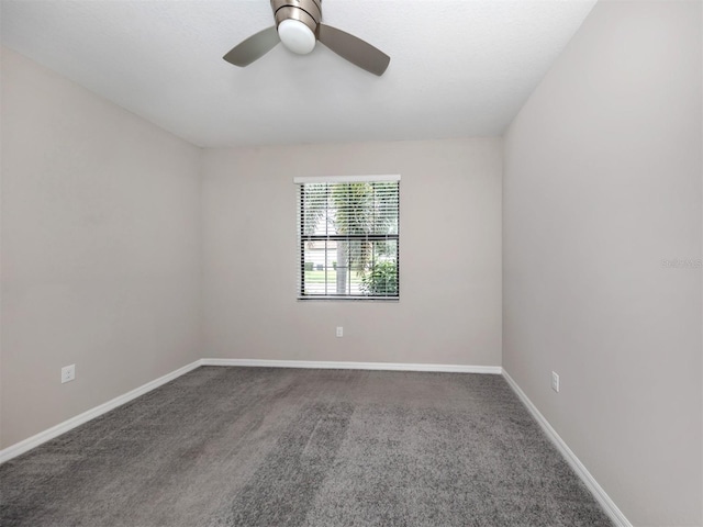 unfurnished room with ceiling fan and carpet flooring