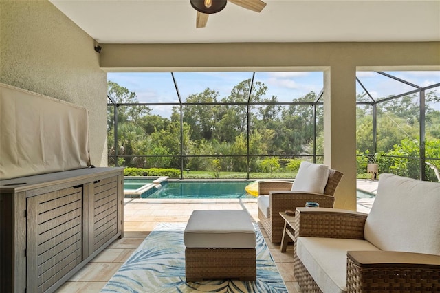 view of pool featuring ceiling fan, a lanai, outdoor lounge area, and a patio area