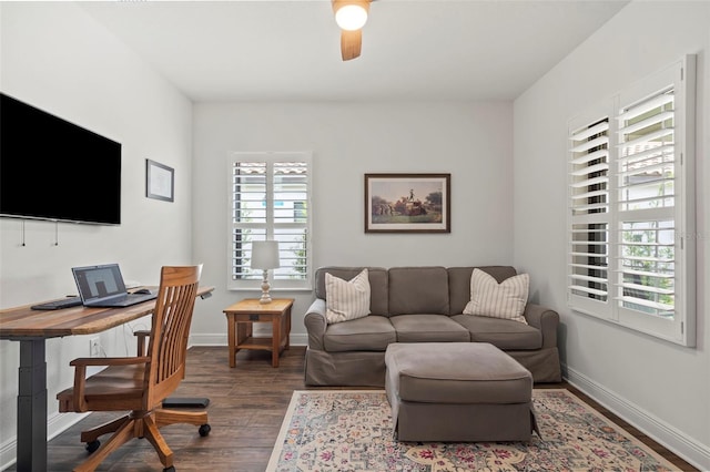 office area featuring dark wood-type flooring and ceiling fan