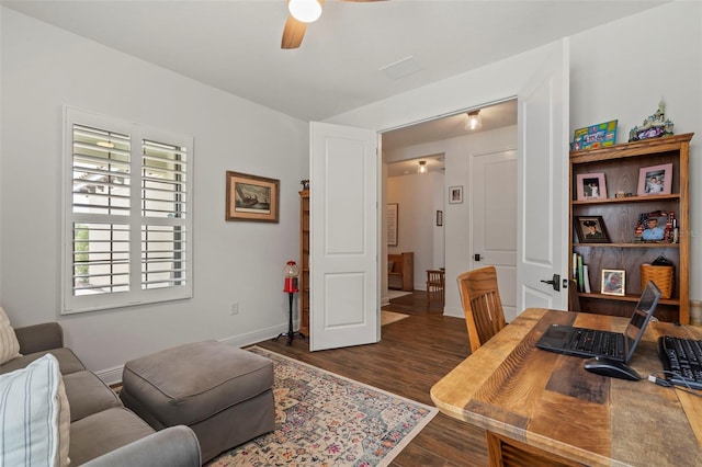 home office with ceiling fan and dark wood-type flooring