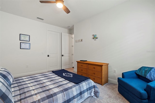 carpeted bedroom with ceiling fan