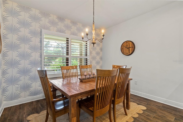 dining space with dark hardwood / wood-style flooring and a chandelier