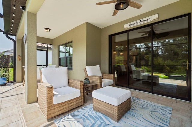 view of patio with ceiling fan and outdoor lounge area