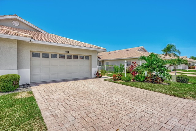 view of front of property featuring a garage