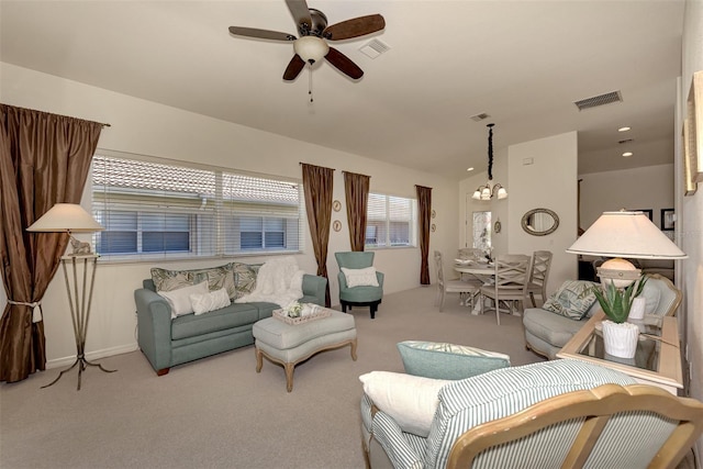 carpeted living room featuring ceiling fan