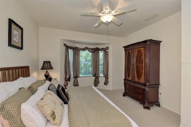 bedroom featuring ceiling fan and carpet