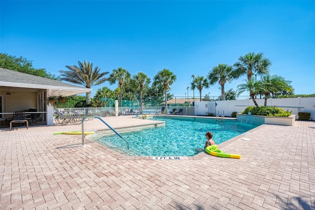 view of swimming pool with a patio