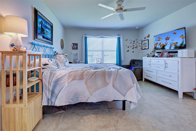 bedroom with a ceiling fan and light tile patterned floors