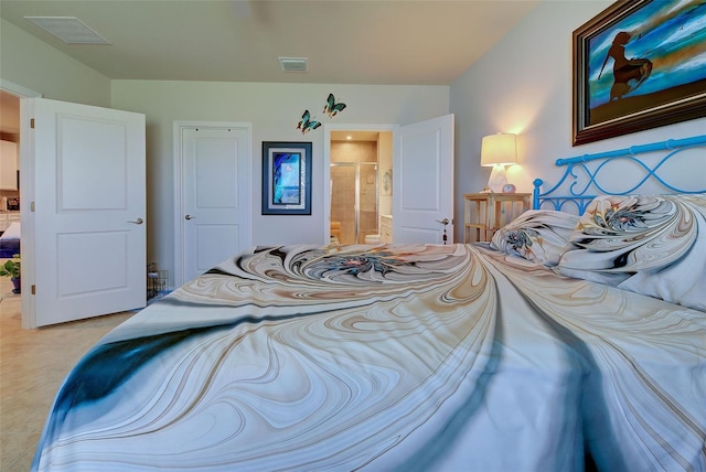 bedroom with visible vents and ensuite bathroom