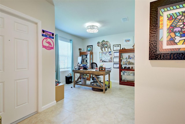 office featuring baseboards and visible vents