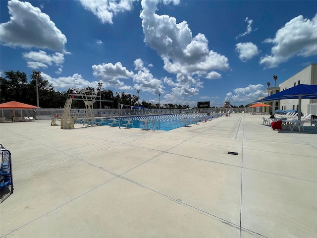 community pool featuring fence