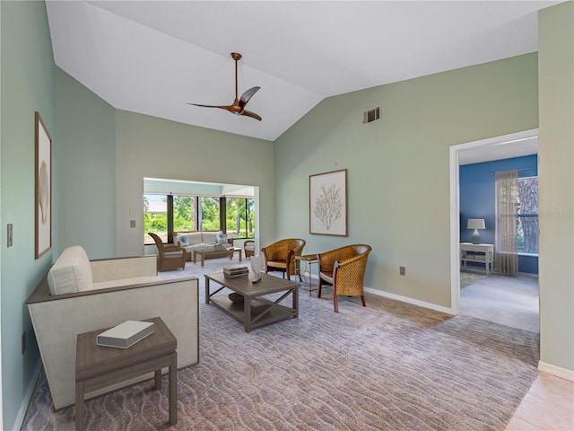 living room with ceiling fan, high vaulted ceiling, and carpet floors