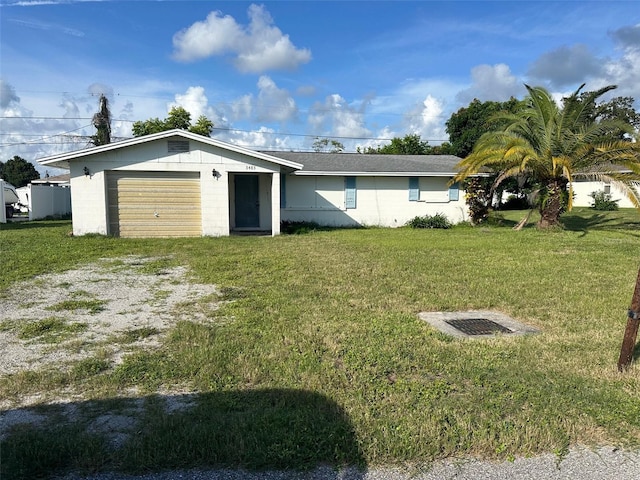 3485 Roslyn Rd, Venice, FL 34293 - single story home featuring concrete block siding, a garage, a front lawn, and driveway