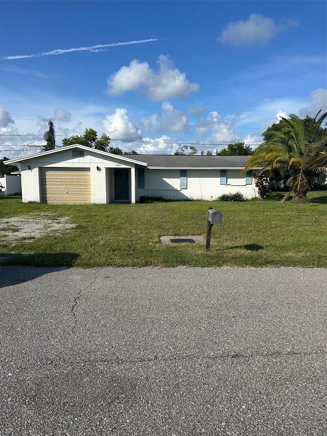 3485 Roslyn Rd, Venice, FL 34293 - view of front of property featuring an attached garage and a front lawn