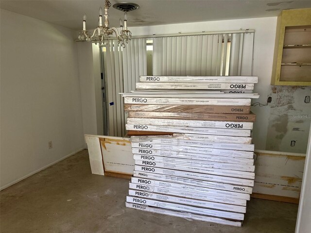 3485 Roslyn Rd, Venice, FL 34293 - detailed view of a chandelier and unfinished concrete flooring