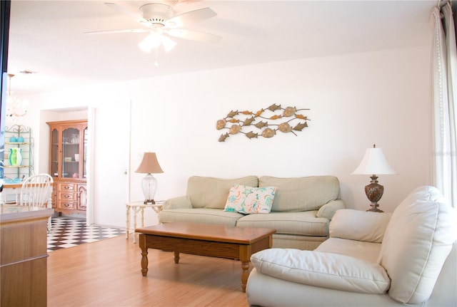 living room with hardwood / wood-style flooring and ceiling fan