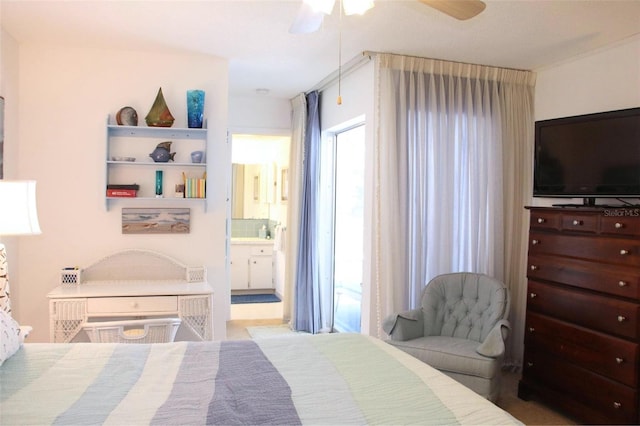 bedroom featuring ceiling fan, connected bathroom, and multiple windows