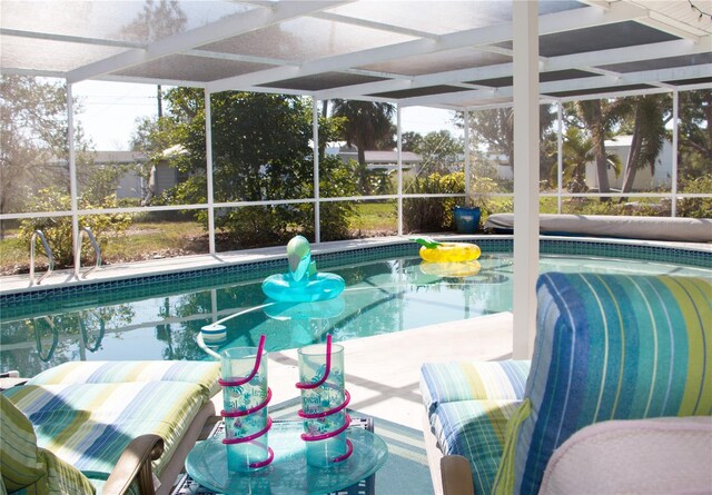 view of pool featuring a lanai and a patio