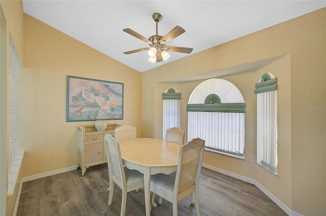 dining area featuring ceiling fan, hardwood / wood-style flooring, and lofted ceiling