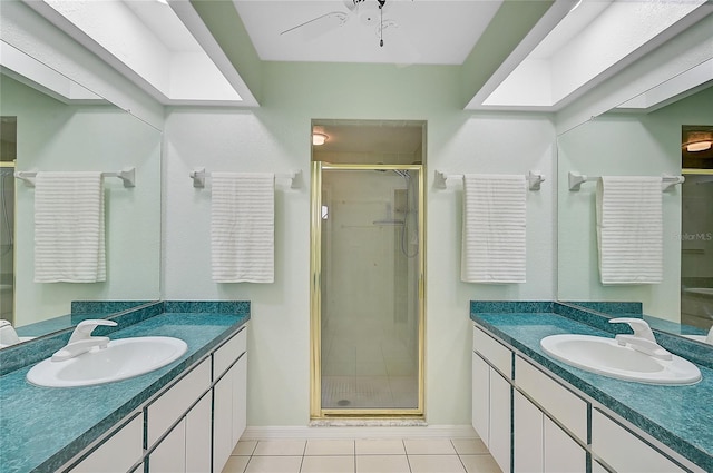 bathroom with tile patterned flooring, an enclosed shower, ceiling fan, and vanity