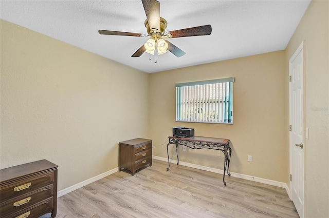 interior space with ceiling fan and light hardwood / wood-style flooring