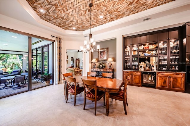 tiled dining space with a notable chandelier, crown molding, and beverage cooler