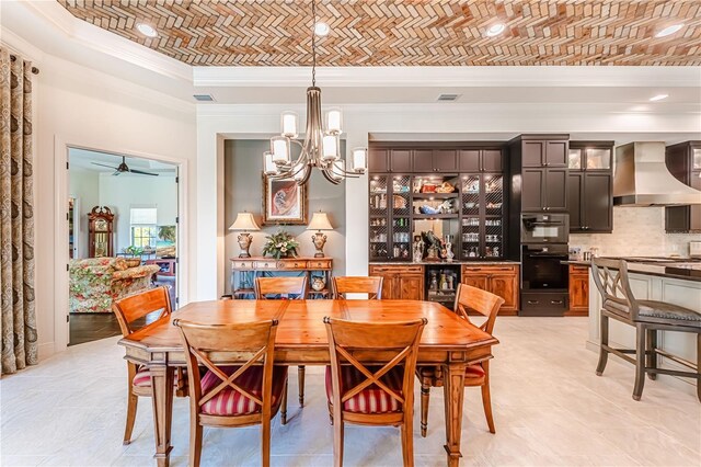 tiled dining area featuring brick ceiling, ceiling fan with notable chandelier, and crown molding