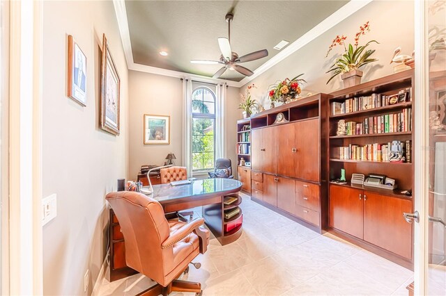 home office with light tile patterned floors, ornamental molding, ceiling fan, and a textured ceiling