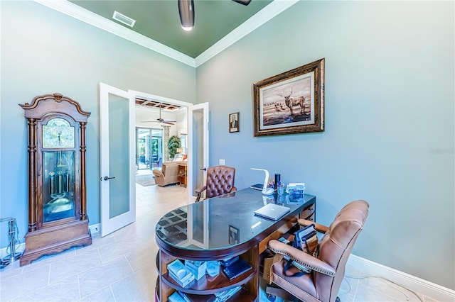 tiled dining space with ceiling fan and ornamental molding