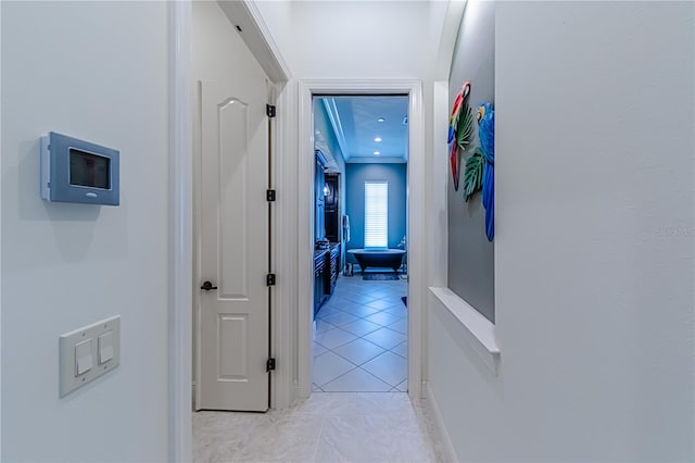 hall with light tile patterned floors