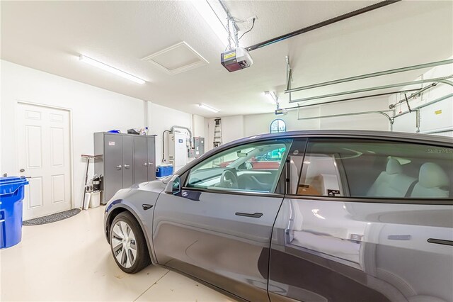 garage featuring a garage door opener and electric panel