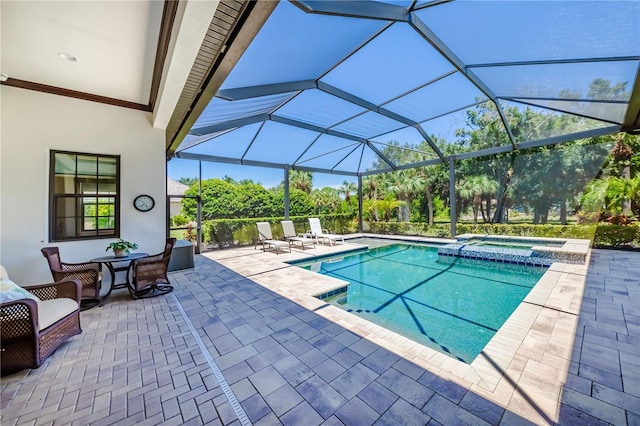 view of swimming pool featuring an in ground hot tub, glass enclosure, and a patio