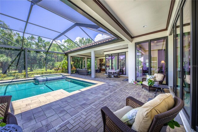 view of pool with glass enclosure, an in ground hot tub, a patio, and an outdoor hangout area