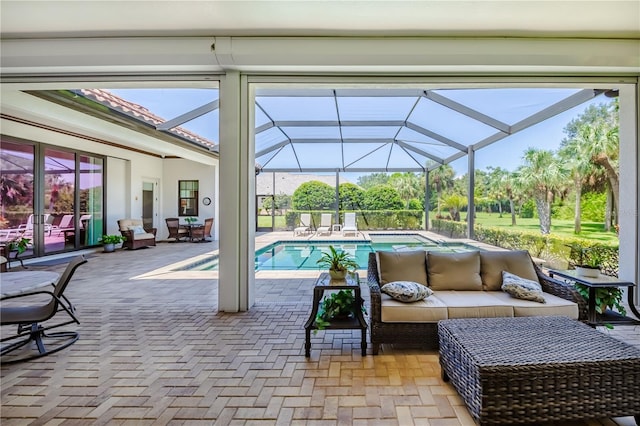 view of pool with a patio, an outdoor hangout area, and a lanai