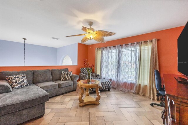 living room with ceiling fan and light parquet flooring