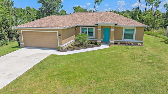 view of front of house featuring a garage and a front lawn