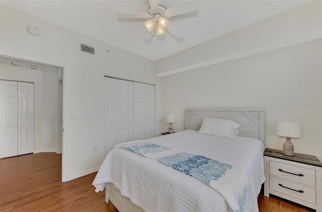 bedroom with ceiling fan and hardwood / wood-style floors