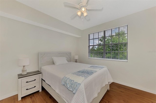 bedroom featuring ceiling fan and dark hardwood / wood-style floors