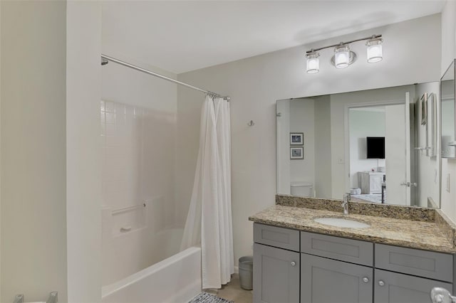 full bathroom featuring toilet, shower / tub combo, and vanity