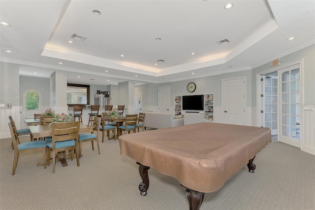 game room featuring a raised ceiling, crown molding, light colored carpet, and billiards