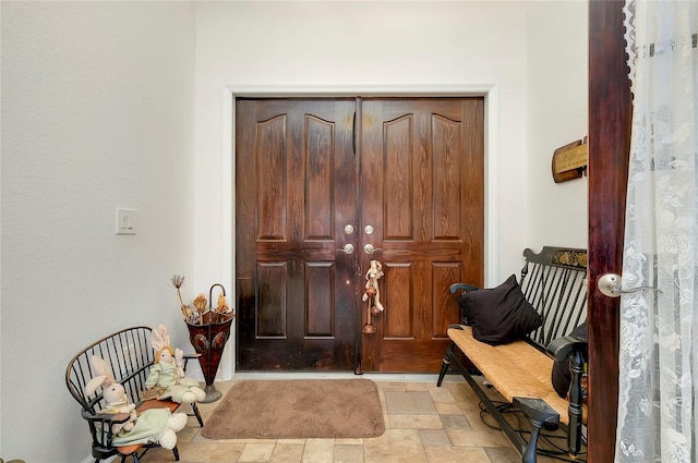 foyer featuring light tile patterned floors