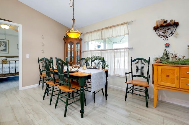 dining area featuring light wood-type flooring