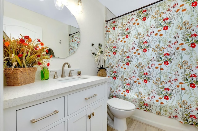 full bathroom with shower / bath combo, toilet, and vanity